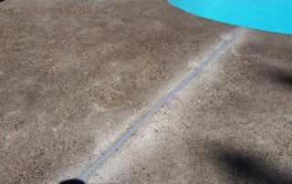 This image shows a pool deck that is being resurfaced.