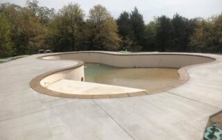 This image shows a pool deck being resurfaced.